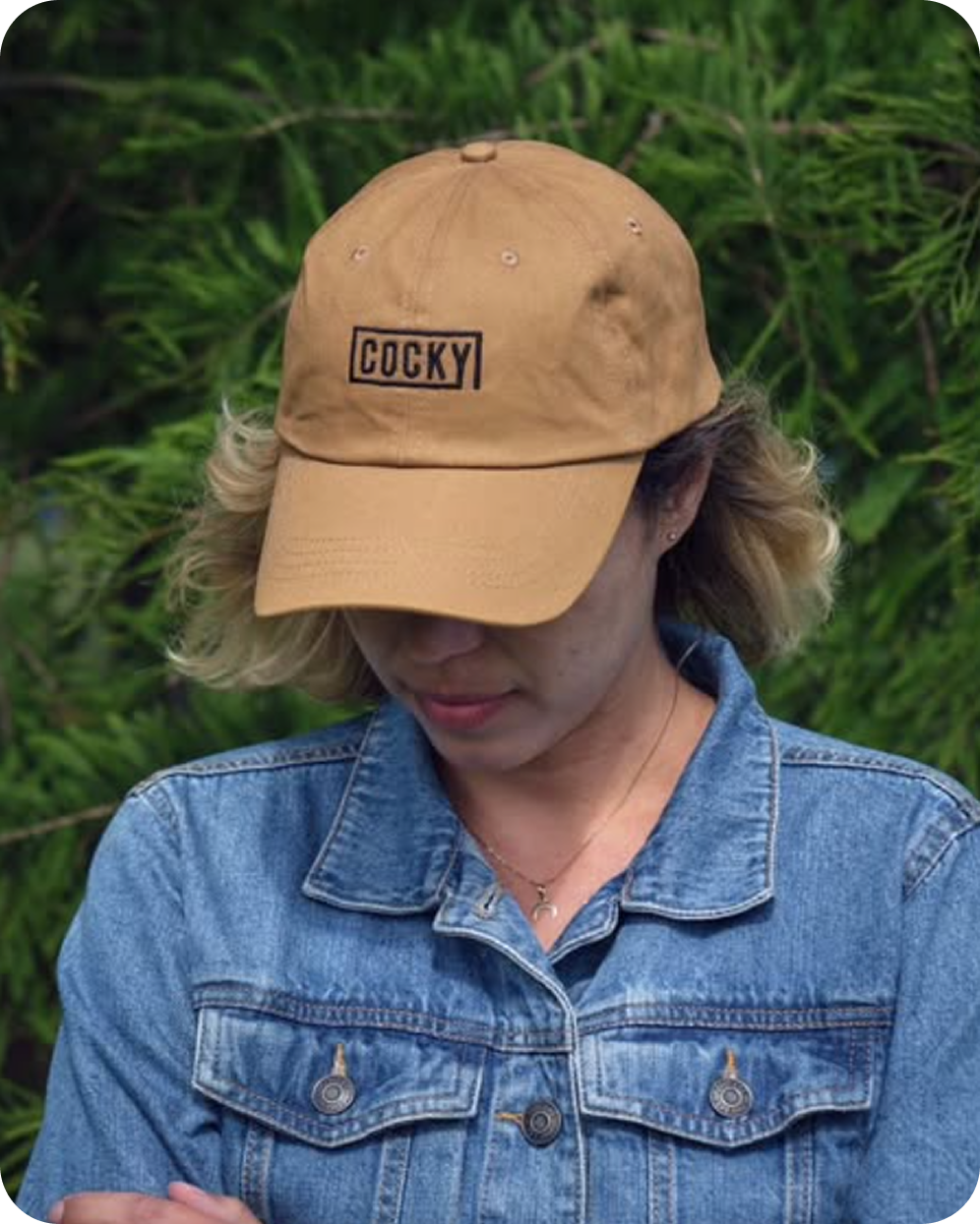 cocky dad cap on woman's head