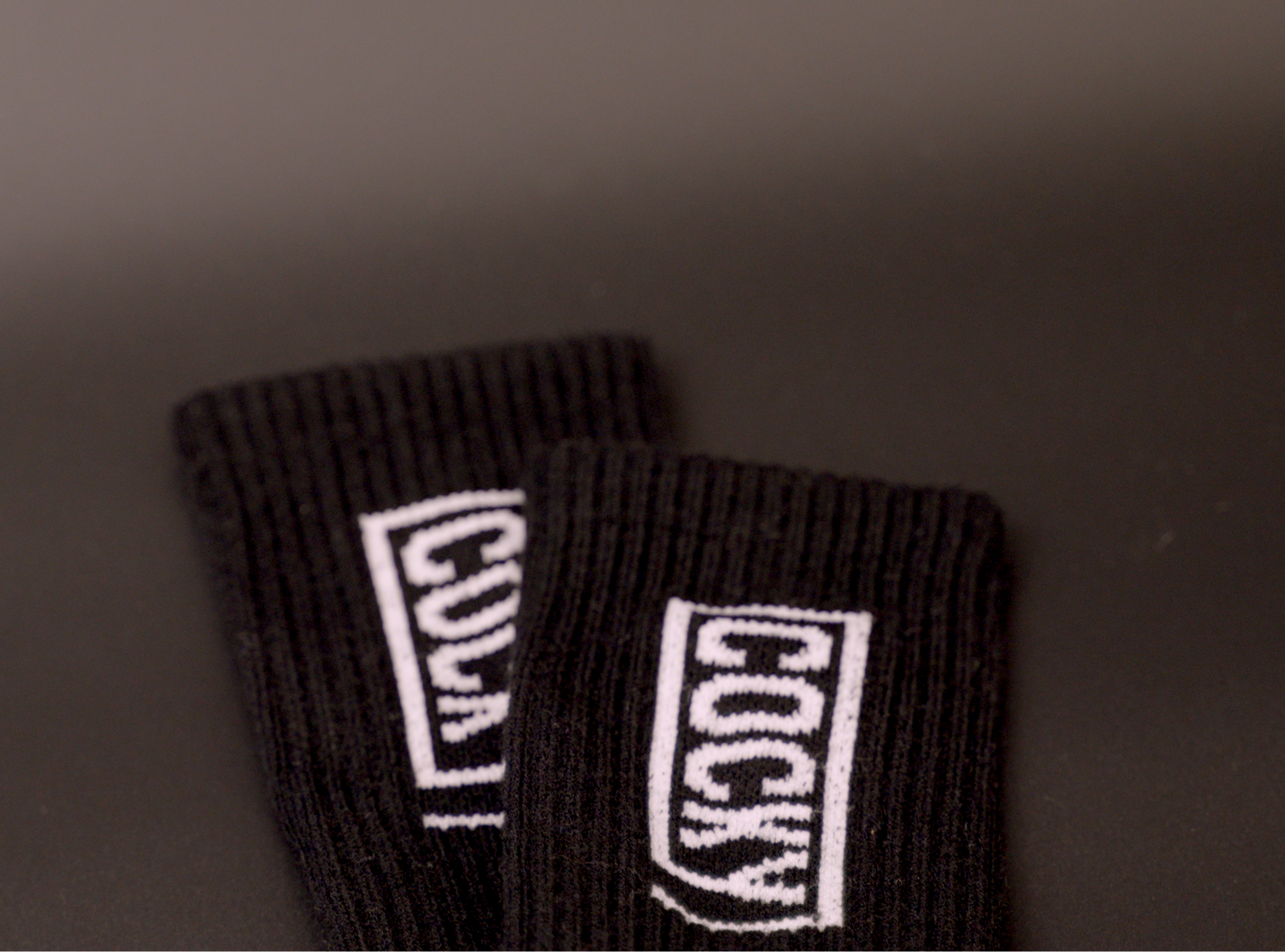 cocky socks, laid on black background