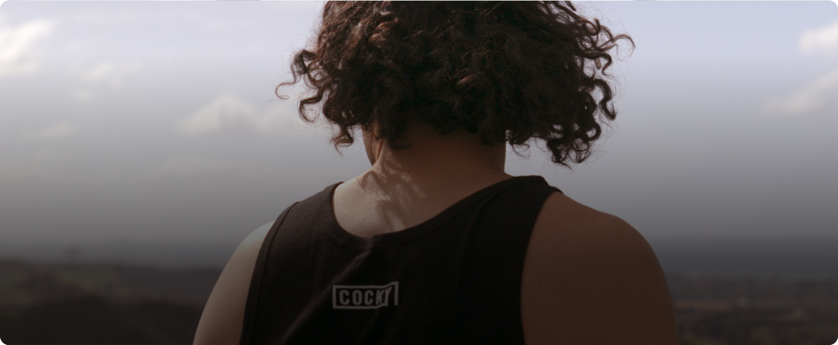 Man facing away from camera - wearing Cocky Singlet