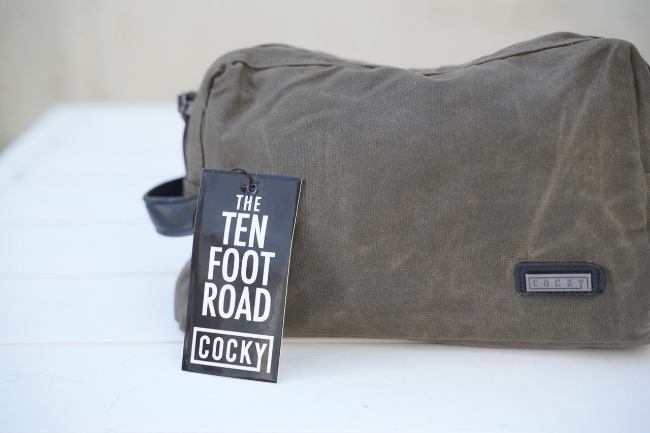 cocky toilet bag on white table