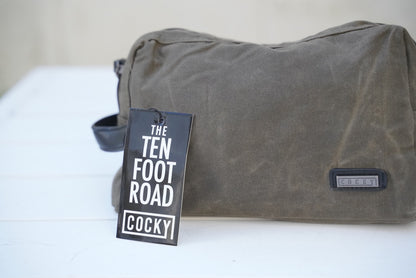 cocky toilet bag on white table