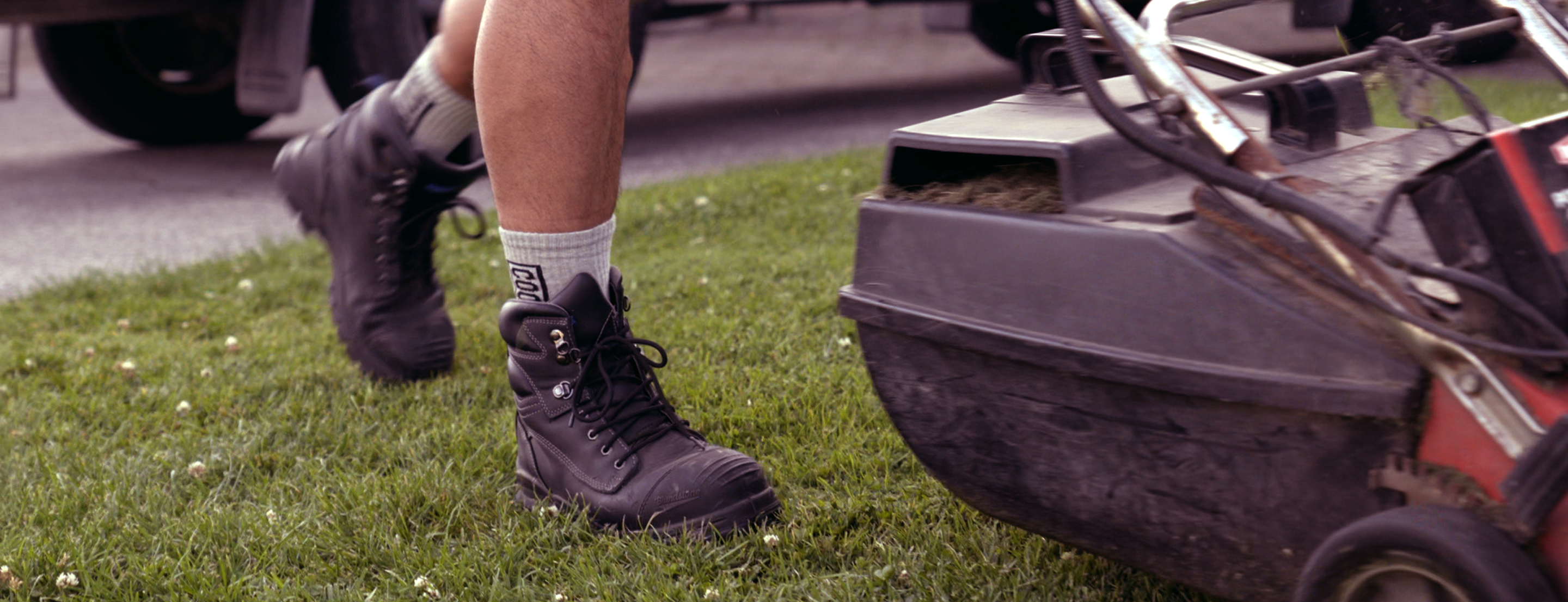 mowing lawns in cocky socks